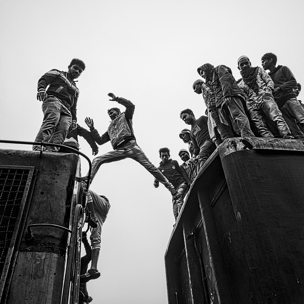 Men Leaping Train by Marcel Rebro — canvas wall art