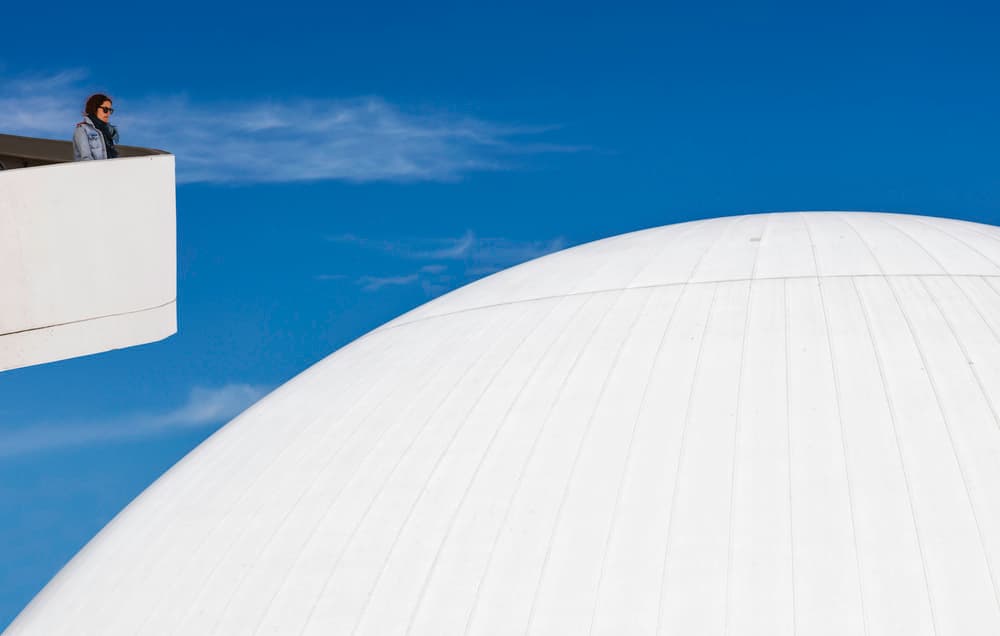 Woman Overlooking White Dome by Rodrigo Núñez Buj — canvas wall art