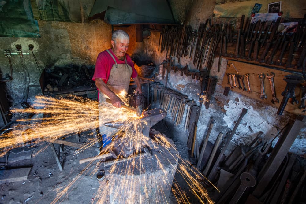 Master Blacksmith Forging Sparks by Zoran Toldi (EFIAP AZSF) — canvas wall art