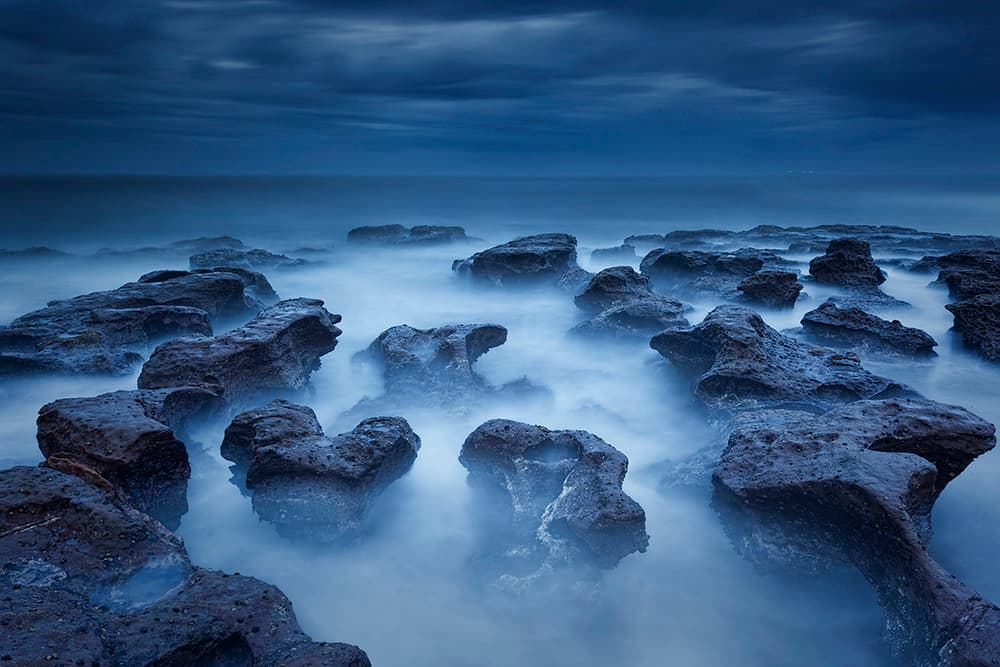 Misty Coastal Rocks by Jingshu Zhu — canvas wall art