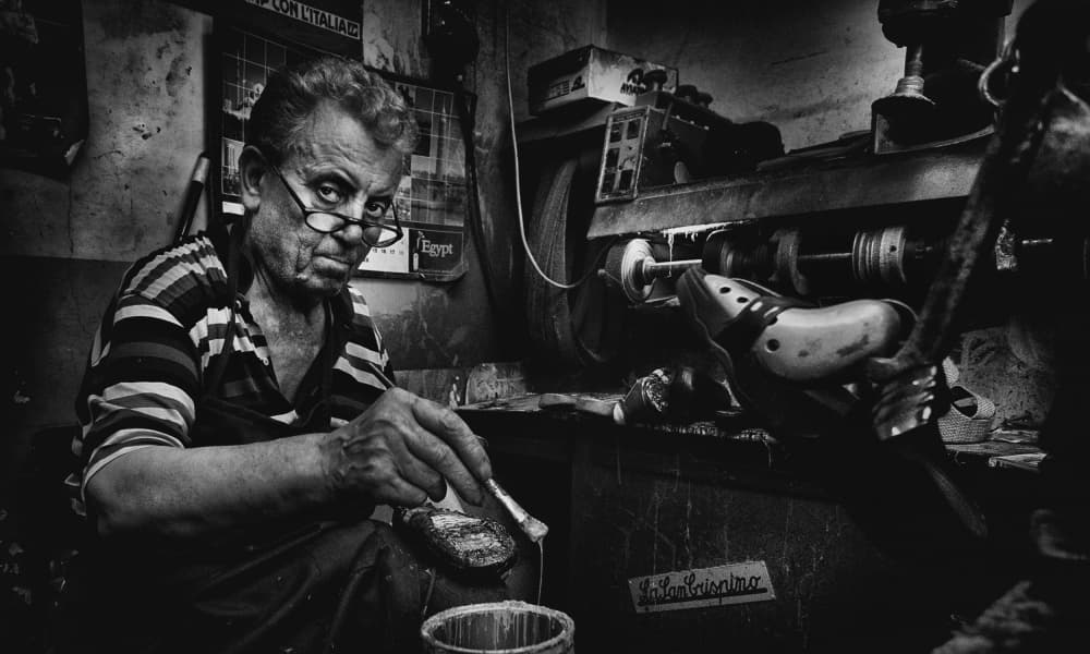 Focused Shoemaker At Work by Antonio Grambone — canvas wall art