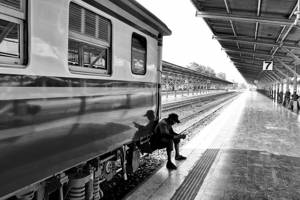 Waiting Man Train Station by Kieron Long — canvas wall art