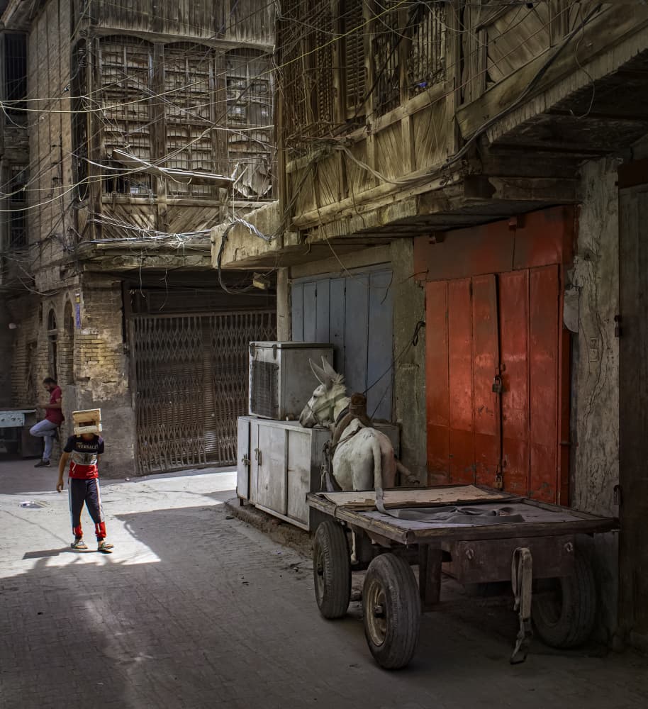 Box Head Boy Alley by Amer Jassim — canvas wall art
