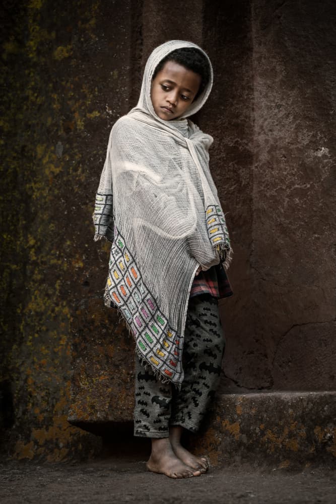 Pensive Child in Shawl by Trevor Cole — canvas wall art