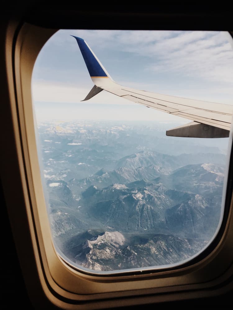 Wing Over Mountain Peaks by Del Mundo Portraits — canvas wall art
