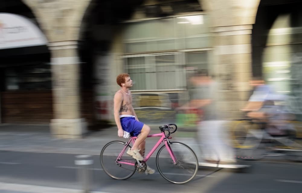 Pink Bike City Motion by Itzik Einhorn — canvas wall art