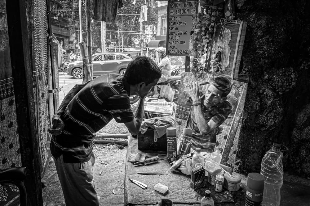 Street Barber Shaving by Subhajit Das — canvas wall art