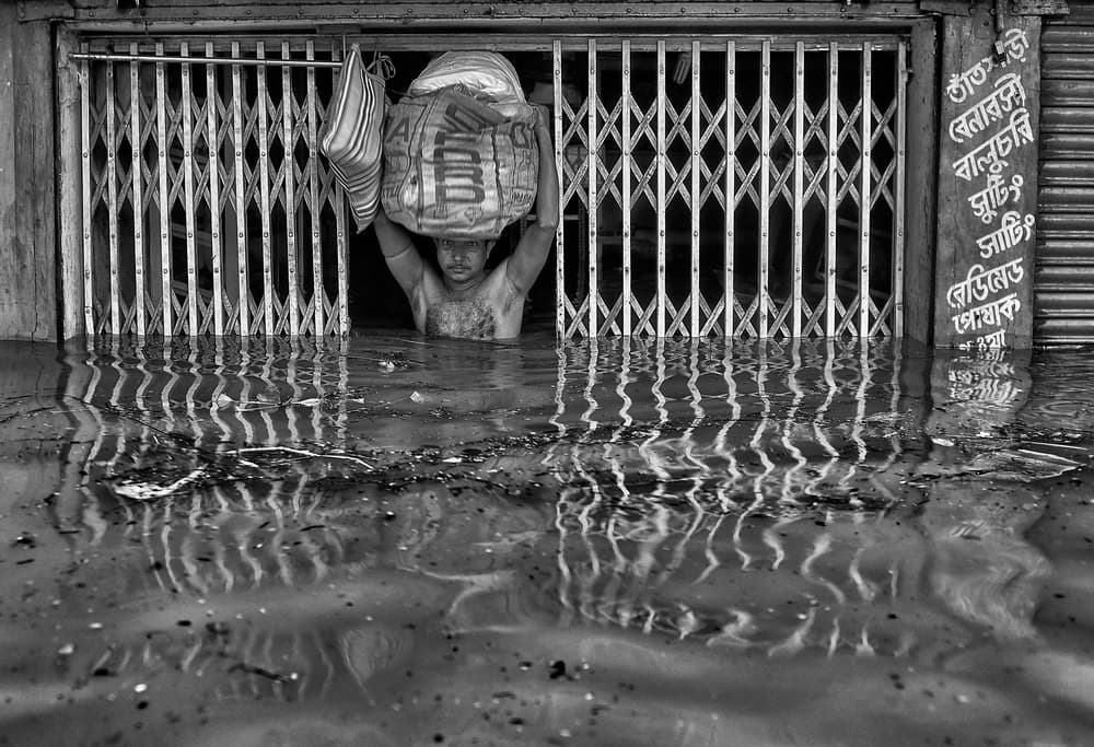 Man In Floodwaters by Avishek Das — canvas wall art