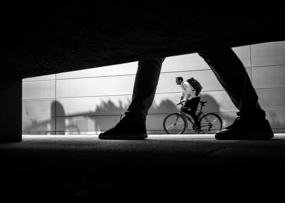 Urban Cyclist Low Angle by Rudy Mareel — canvas wall art