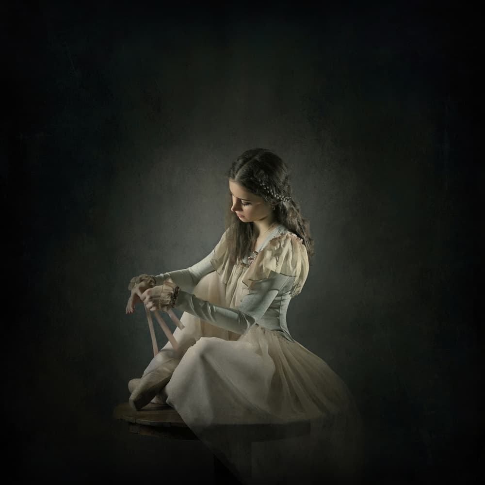 Ballerina Preparing Pointe Shoes by Moein Hasheminasab — canvas wall art