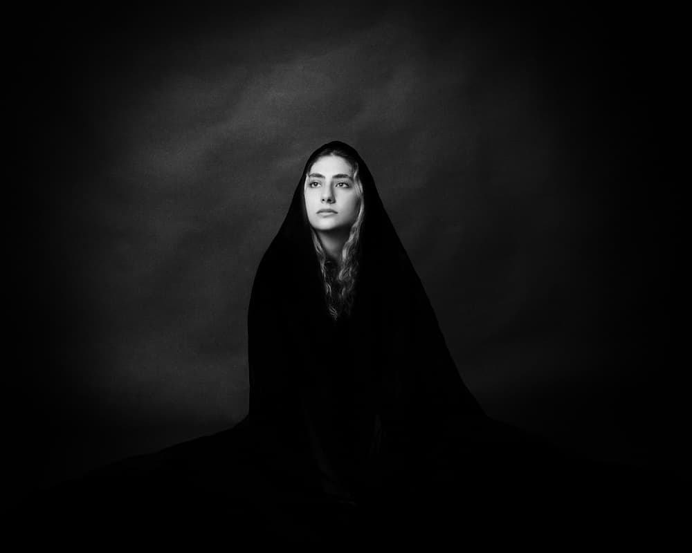 Pensive Hooded Woman by Mehdi Mokhtari — canvas wall art