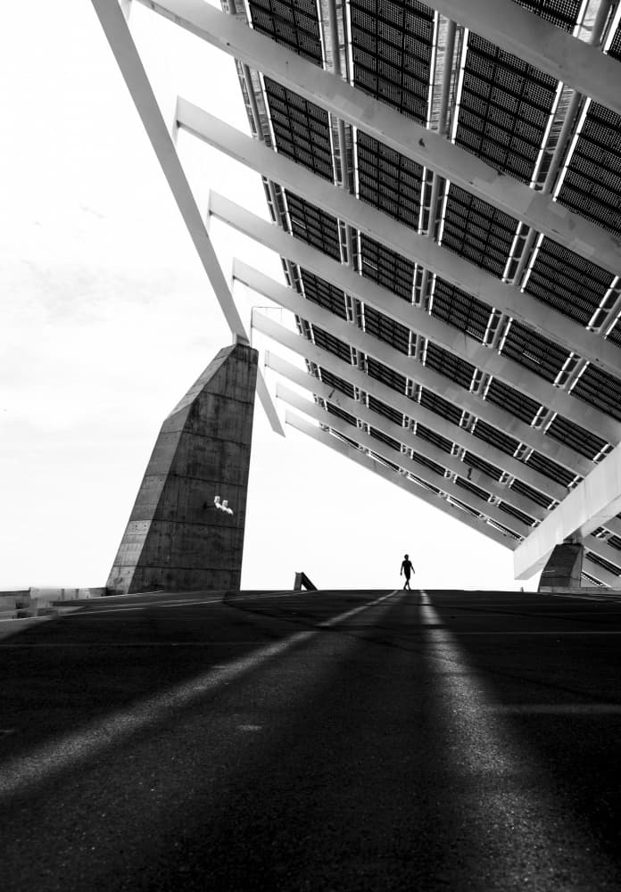 Lone Figure Under Solar Array by Anna Niemiec — canvas wall art