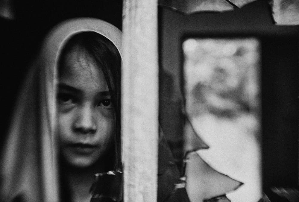 Child's Watchful Gaze by Andi Halil — canvas wall art