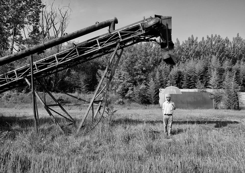 Man and Abandoned Conveyor by Carlo Ferrara — canvas wall art