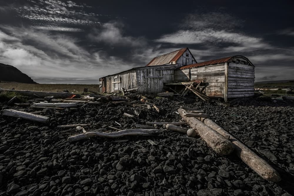 Weathered Coastal Building by Bragi Ingibergsson - BRIN — canvas wall art