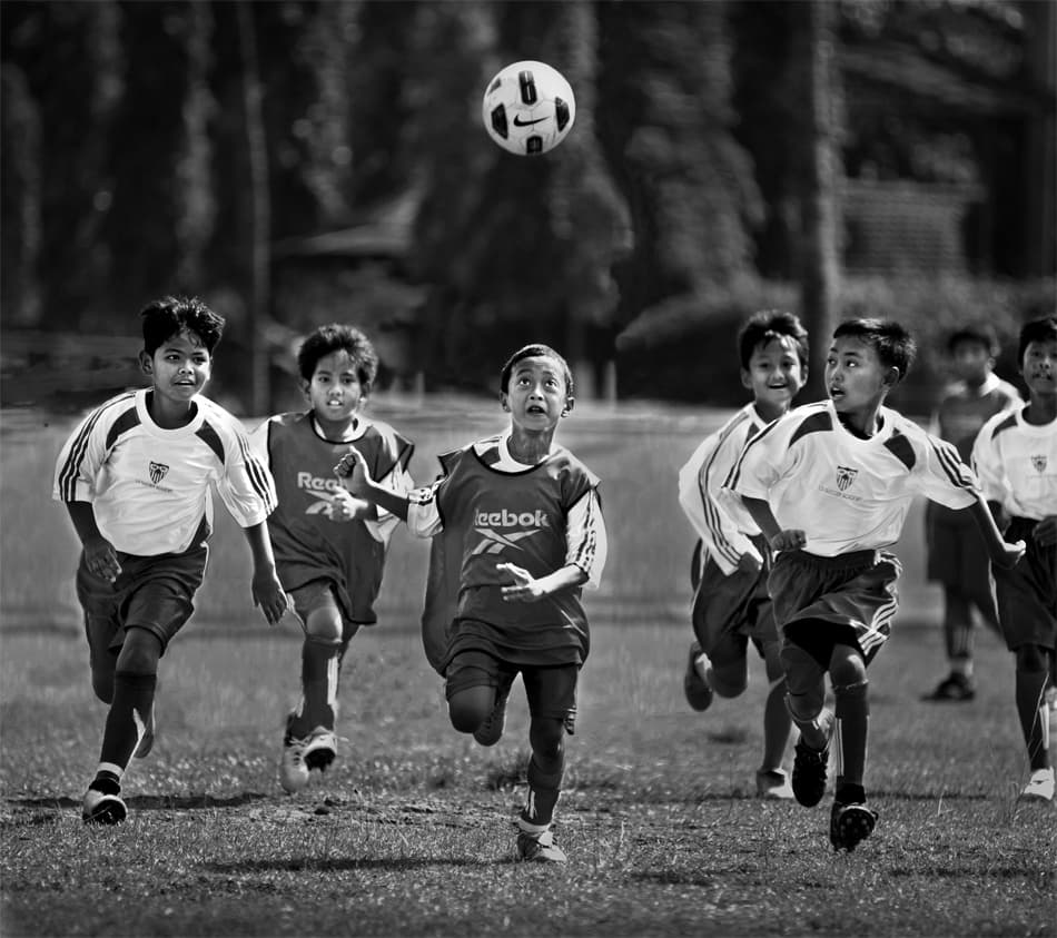 Youth Soccer Action by Sebastian Kisworo — canvas wall art