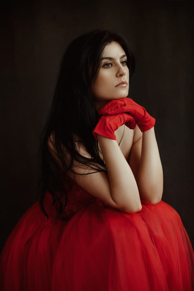 Thoughtful Woman in Red by Raluca Arhire — canvas wall art