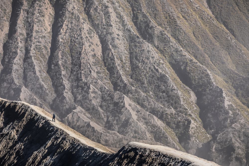 Lone Hiker Mountain Ridge by Marco Tagliarino — canvas wall art