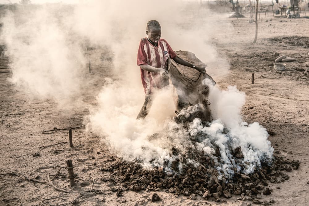Boy Working Amid Smoke by Trevor Cole — canvas wall art