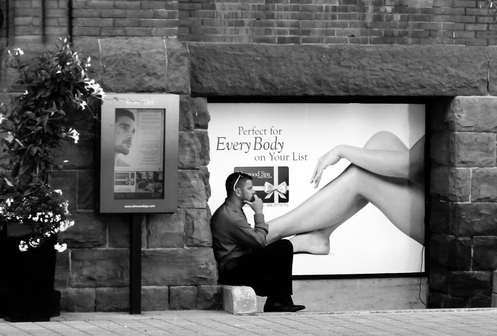Man Contemplating Advertising by Jian Wang — canvas wall art