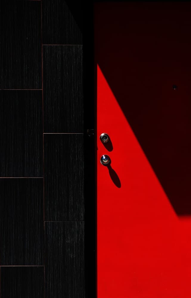 Red Door Shadow Play by Jian Wang — canvas wall art