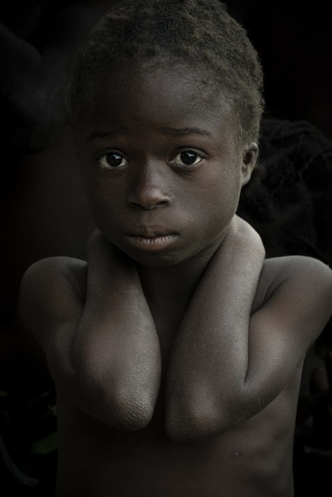 Pensive Young Child by Elena Molina — canvas wall art
