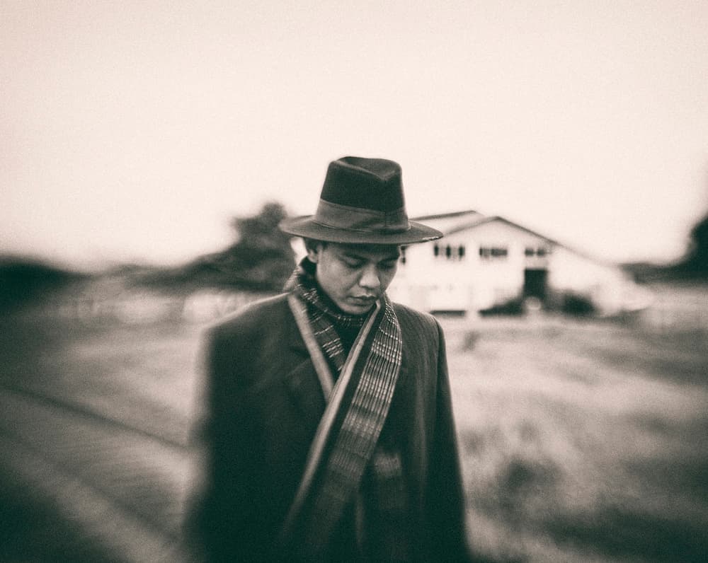 Pensive Man Fedora by Andi Halil — canvas wall art