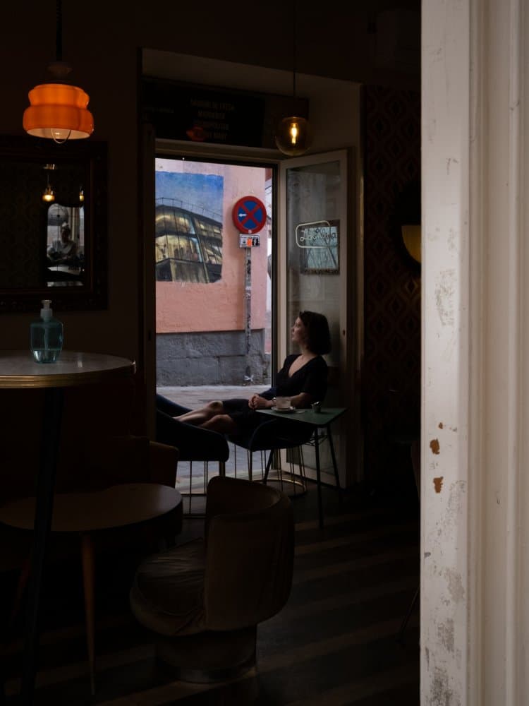 Woman by Cafe Window by Bego Amare — canvas wall art