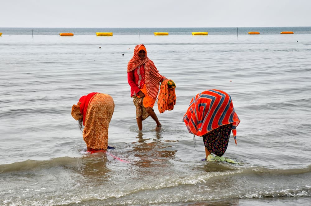 Coastal Women Washing by Shaibal Nandi — canvas wall art