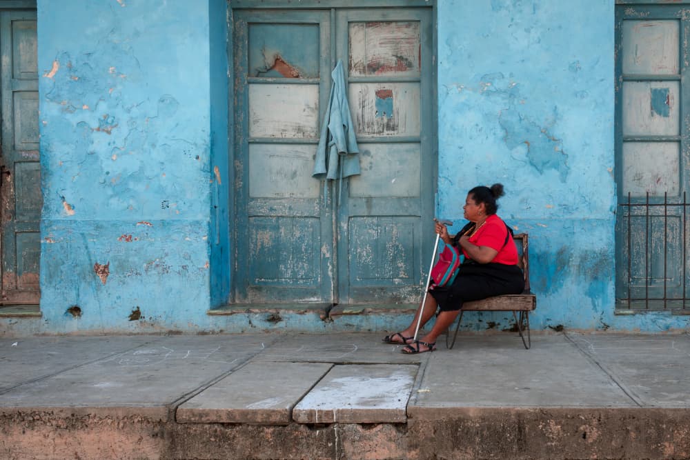 Woman by Blue Door by Andy Bauer — canvas wall art