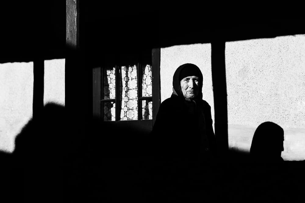 Elderly Woman Window Light by Marius Cinteza — canvas wall art