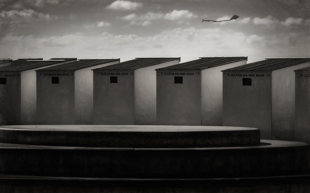 Seaside Huts Flying Kite by Marc Huybrighs — canvas wall art