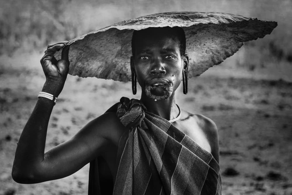 Mursi Woman's Gaze by Svetlin Yosifov — canvas wall art