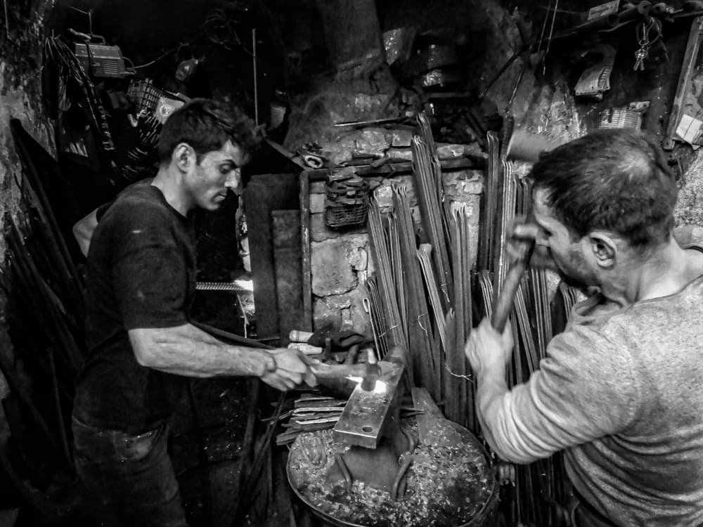 Blacksmiths At The Forge by Bashar Alsofey — canvas wall art