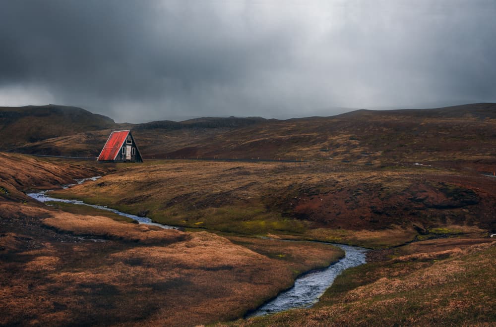 Remote Red Cabin Stream by May G — canvas wall art