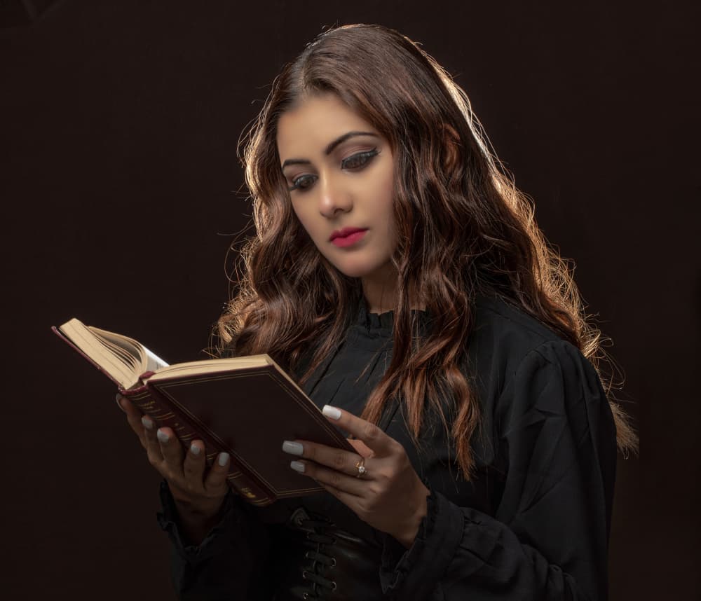 Elegant Woman Reading Book by DEBASISH CHATTOPADHYAY — canvas wall art