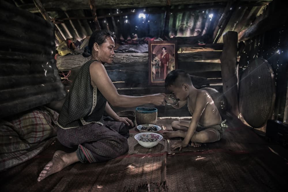 Sharing a Simple Meal by Sarawut Intarob — canvas wall art