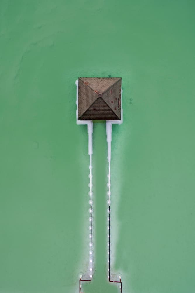 Green Water Pier House by Eyal Amer — canvas wall art