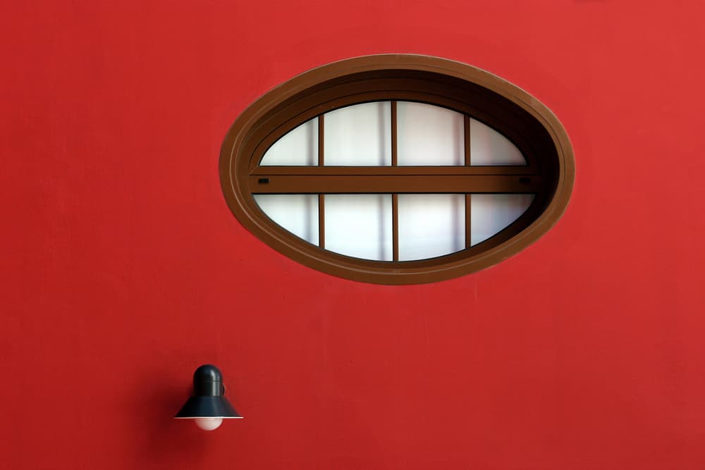Vibrant Red Oval Window by Hans-Wolfgang Hawerkamp — canvas wall art