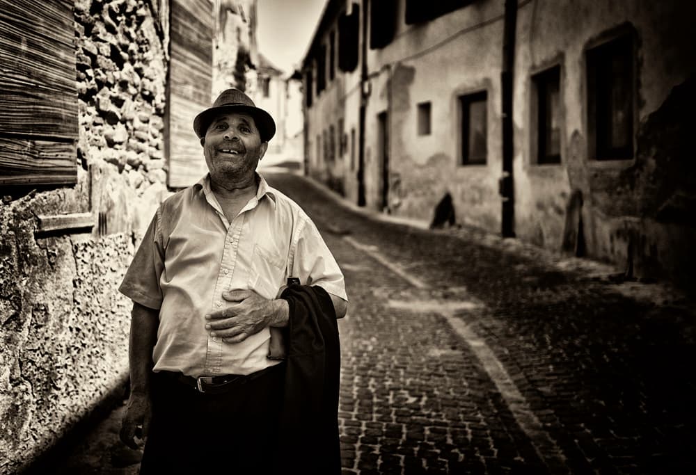 Smiling Man Old Street by Julien Oncete — canvas wall art