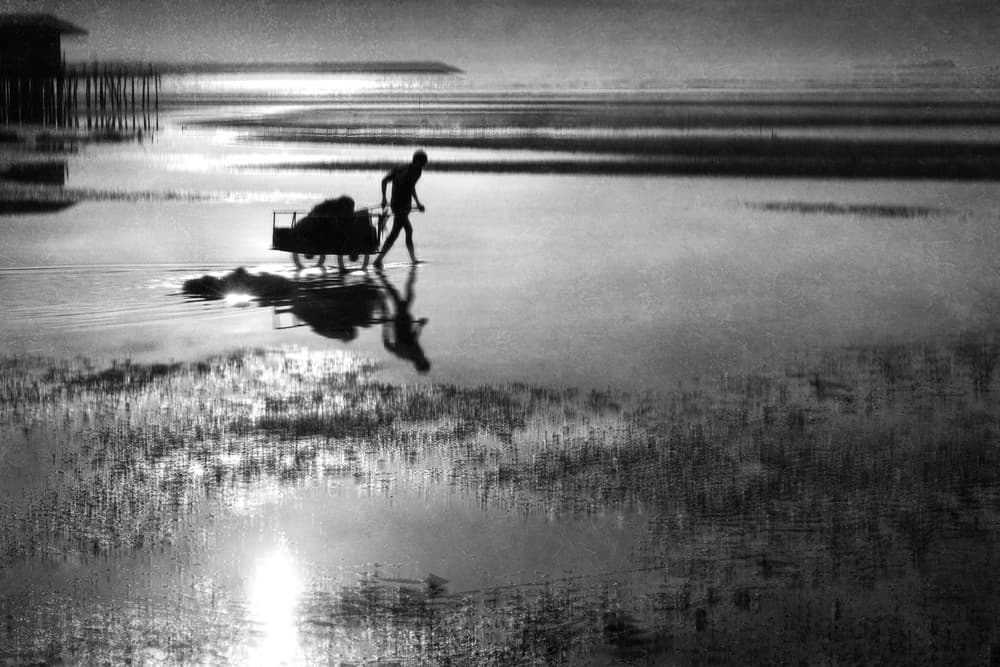 Man Pushing Cart Reflection by Ekkachai Khemkum — canvas wall art