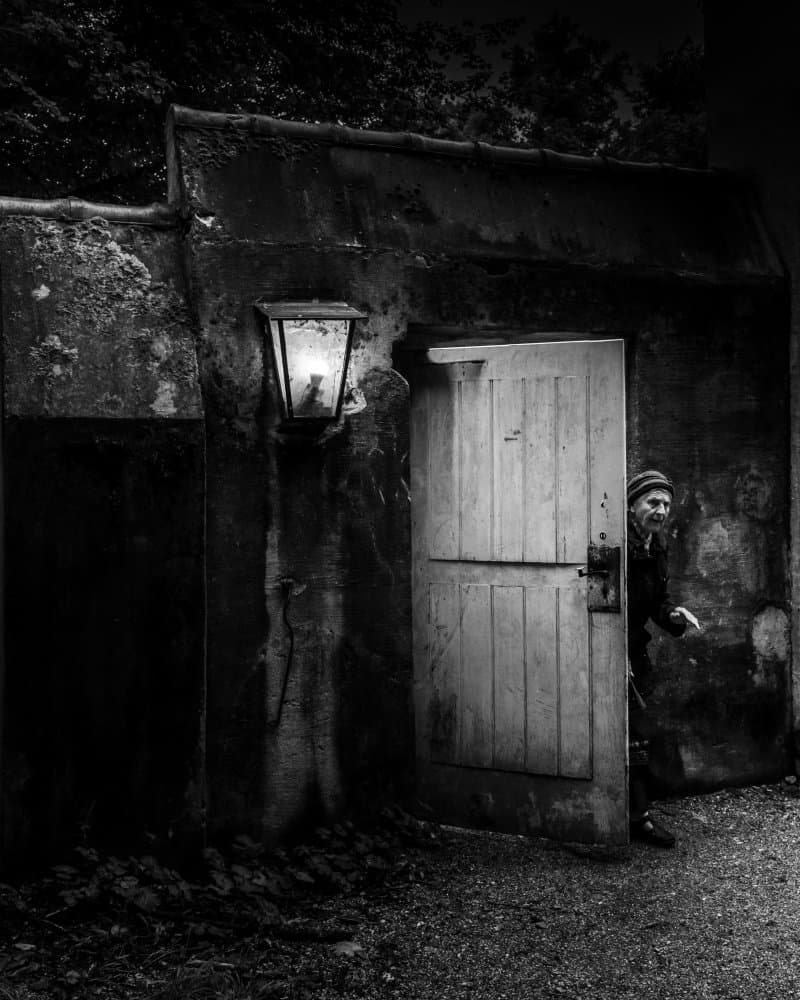 Man Behind Old Door by Andy Dauer — canvas wall art