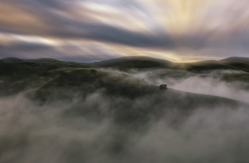 Sunrise Over Misty Hills by Jenny Qiu — canvas wall art