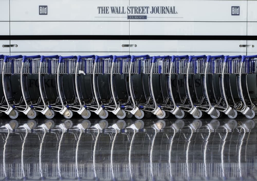 Orderly Airport Carts by Wayne Pearson — canvas wall art