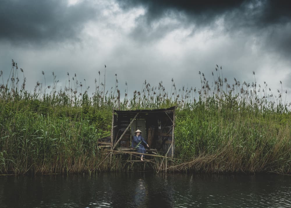 Woman By Tranquil Reeds by Hooman Sedaghi — canvas wall art
