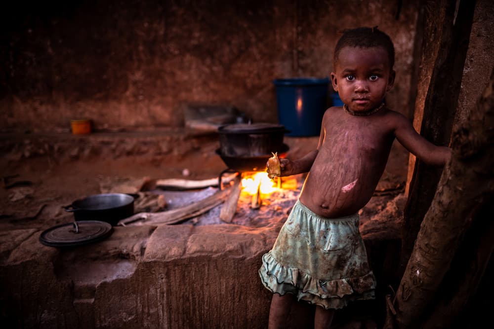 African Girl by Firelight by Marco Tagliarino — canvas wall art