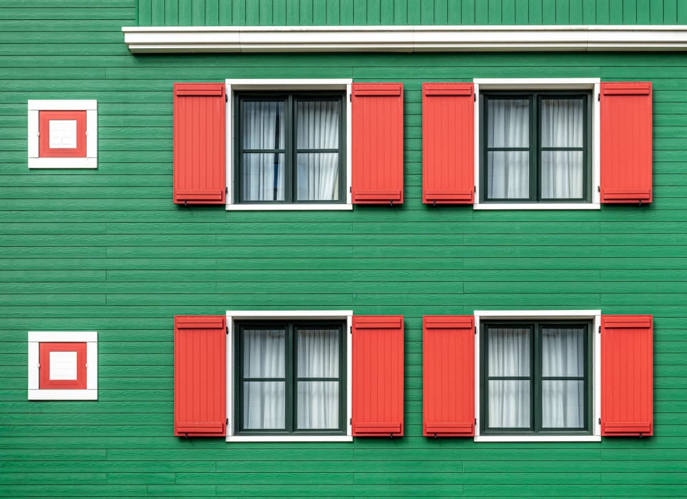 Green Facade Red Shutters by Roland M Schwerdtfeger — canvas wall art