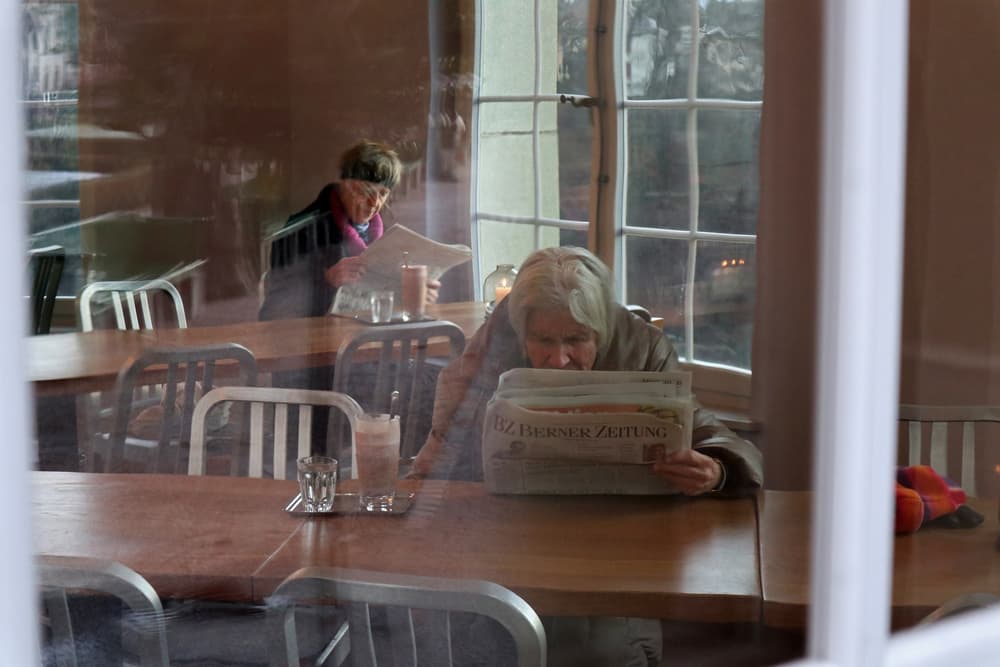 Cafe Reading Reflection by Giorgio Pizzocaro — canvas wall art