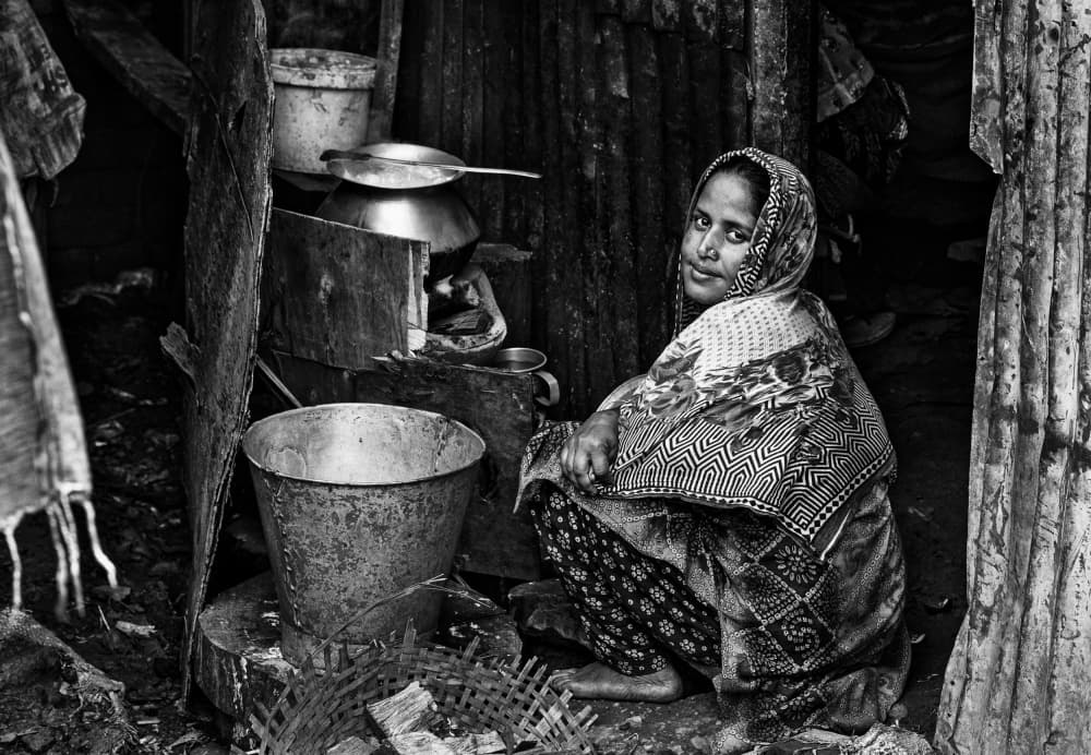 Woman in Simple Kitchen by Joxe Inazio Kuesta Garmendia — canvas wall art