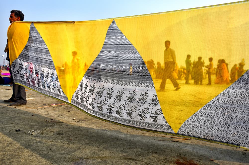 Market Through Yellow Fabric by Avishek Das — canvas wall art